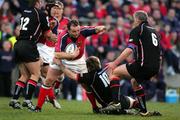 16 April 2005; Rob Henderson, Munster, is tackled by Phil Godman and Todd Blackadder, Edinburgh Rugby. Celtic League 2004-2005, Pool 1, Munster v Edinburgh Rugby, Thomond Park, Limerick. Picture credit; Kieran Clancy / SPORTSFILE