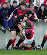 16 April 2005; Shaun Payne, Munster, is tackled by Marcus Di Rollo, Edinburgh Rugby. Celtic League 2004-2005, Pool 1, Munster v Edinburgh Rugby, Thomond Park, Limerick. Picture credit; Kieran Clancy / SPORTSFILE