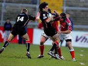 16 April 2005;  Marcus Di Rollo and Chris Paterson (14), Edinburgh Rugby, is tackled by Denis Leamy and Mike Mullins, Munster. Celtic League 2004-2005, Pool 1, Munster v Edinburgh Rugby, Thomond Park, Limerick. Picture credit; Kieran Clancy / SPORTSFILE