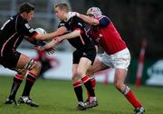 16 April 2005; Chris Paterson and David Callam, Edinburgh Rugby, is tackled by Alan Quinlan, Munster. Celtic League 2004-2005, Pool 1, Munster v Edinburgh Rugby, Thomond Park, Limerick. Picture credit; Kieran Clancy / SPORTSFILE