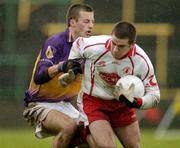17 April 2005; Philip Jordan, Tyrone, in action against Paddy Colfer, Wexford. Allianz National Football League, Division 1 Semi-Final, Tyrone v Wexford, O'Moore Park, Portlaoise, Co. Laois. Picture credit; Pat Murphy / SPORTSFILE