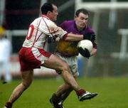 17 April 2005; Colm Morris, Wexford, in action against Brian Dooher, Tyrone. Allianz National Football League, Division 1 Semi-Final, Tyrone v Wexford, O'Moore Park, Portlaoise, Co. Laois. Picture credit; Pat Murphy / SPORTSFILE