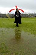 17 April 2005; Helen O'Rourke, Chief Executive of the Ladies Football Association, inspects the pitch in advance of the match being called off. Suzuki Ladies National Football League Final, Galway v Cork, Dr. Hyde Park, Roscommon. Picture credit; Ray McManus / SPORTSFILE