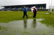 17 April 2005; Match referee Joe Murray and Helen O'Rourke, Chief Executive of the Ladies Football Association, inspects the pitch in advance of the match being called off. Suzuki Ladies National Football League Final, Galway v Cork, Dr. Hyde Park, Roscommon. Picture credit; Ray McManus / SPORTSFILE