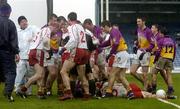 17 April 2005; Players from both sides get involved in a tussle after an incident between Wexford's Mattie Forde and Tyrone's Conor Gormley. Allianz National Football League, Division 1 Semi-Final, Tyrone v Wexford, O'Moore Park, Portlaoise, Co. Laois. Picture credit; Pat Murphy / SPORTSFILE