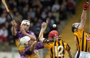 17 April 2005; Darren Stamp and David O'Connor, Wexford, in action against Tommy Walsh, 12 and DJ Carey, Kilkenny. Allianz National Hurling League, Division 1, Round 2, Kilkenny v Wexford, Nowlan Park, Kilkenny. Picture credit; Matt Browne / SPORTSFILE