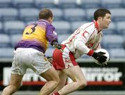 17 April 2005; Enda McGinley, Tyrone, in action against Philip Wallace, Wexford. Allianz National Football League, Division 1 Semi-Final, Tyrone v Wexford, O'Moore Park, Portlaoise, Co. Laois. Picture credit; Pat Murphy / SPORTSFILE