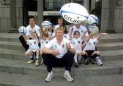 19 April 2005; Irish Rugby Players Leo Cullen, Guy Easterby, left, and Reggie Corrigan, right, with eight rugby mad girls and boys at the launch of the Ulster Bank and IRFU Summer Rugby camps which will take place nationwide throughout July and August. Ulster Bank, Georges Quay, Dublin. Picture credit; Damien Eagers / SPORTSFILE