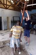 25 February 2005; Galway's Alan Kerins with labourer Simasiku working on the block making project. Cheshire home for the physically challenged children, Mongu, Zambia. Picture credit; Damien Eagers / SPORTSFILE