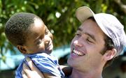 25 February 2005; Galway's Alan Kerins with Mwiya. Cheshire home for the physically challenged children, Mongu, Zambia. Picture credit; Damien Eagers / SPORTSFILE