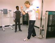 21 April 2005; Double Olympic champion Haile Gebreselaisse watches UCD athlete Rob Daly work out during the official opening of the new sporting facilities in UCD. Belfield, UCD, Dublin. Picture credit; Pat Murphy / SPORTSFILE