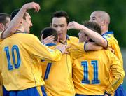 21 April 2005; Richie Baker (11), Shelbourne, is congratulated after scoring his sides second goal by team-mates from left to right, Jim Crawford, Jason Byrne, Wesley Hoolahan, David Crawley and Dave Rogers. eircom League, Premier Division, Longford Town v Shelbourne, Flancare Park, Longford. Picture credit; David Maher / SPORTSFILE