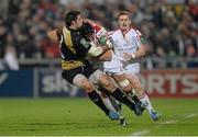 10 January 2014; Dan Tuohy, Ulster, is tackled by Johnnie Beattie, Montpellier. Heineken Cup 2013/14, Pool 5, Round 5, Ulster v Montpellier, Ravenhill Park, Belfast, Co. Antrim. Photo by Sportsfile