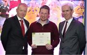 10 January 2014; Today the GAA held their Games Development Conference with the theme &quot; Inspiring Children: Fostering a Love of Gaelic Games&quot;. Bryan Bates is presented with his certificate for Level 2 GAA Tutor Trainer by Micheál Martin, left, Chairman National Games Committee, and Michael McGeehin, right, Director Coaching Ireland. Liberty Insurance Coaching Development Conference, Croke Park, Dublin. Picture credit: Barry Cregg / SPORTSFILE