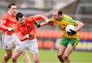 12 January 2014; Colm McFadden, Donegal, in action against Stefan Forker, Armagh. Power NI Dr. McKenna Cup, Section A, Round 2, Armagh v Donegal, Athletic Grounds, Armagh. Picture credit: Oliver McVeigh / SPORTSFILE