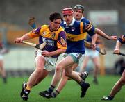 21 March 1999; Adrian Fenlon of Wexford in action against Paul Ormonde of Tipperary during the Church and General National Hurling League Division 1B match between Tipperary and Wexford at Semple Stadium in Thurles, Tipperary. Photo by Ray McManus/Sportsfile