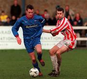 28 February 1999; Aidan Lynch of UCD in action against Jan Hoecks of Sligo Rovers during the Harp Lager National League Premier Division match between UCD and Sligo Rovers at Belfield Park in Dublin. Photo by David Maher/Sportsfile