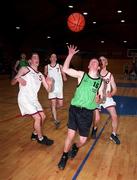 10 March 1999; Andrew McAllen of Tralee Community College, Kerry, shoots for a score watched by Aidan O'Sullivan, left, Jason Ryan, centre, and David Egan of St Joseph's Spanish Point, Sligo, during the U19 All Ireland School Boys Basketball Final match between Tralee Community College, Kerry, and St Joseph's Spanish Point, Sligo, at the National Basketball Arena in Dublin. Photo by Brendan Moran/Sportsfile