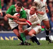 4 April 1998; Andy Ward of Ireland is tackled by Neil Back of England during the Five Nations Rugby Championship match between England and Ireland at Twickenham Stadium in London, England. Photo by Brendan Moran/Sportsfile