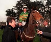24 January 1999; Jockey Charlie Swan is congratulated by owner JP McManus after winning the AIG Championship hurdle on Istabraq at Leopardstown Racecourse in Dublin. Photo by Ray McManus/Sportsfile