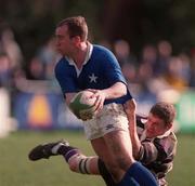 13 March 1999; Conor McGuinness of St Marys College is tackled by Peter O'Malley of Terenure during the AIB All-Ireland League Division 1 match between St Marys College and Terenure at Templeville Road in Dublin. Photo by Brendan Moran/Sportsfile