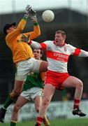 28 Feburary 1999; Meath goalkeeper Cormac Sullivan in action against Dermot Heaney of Derry during the Church and General National Football League Division 1 match between Meath and Derry at Páirc Tailteann in Navan, Meath. Photo by Ray McManus/Sportsfile