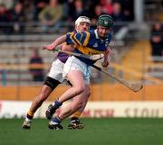 21 March 1999; David Kennedy of Tipperary in action against Martin Storey of Wexford during the Church and General National Hurling League Division 1B match between Tipperary and Wexford at Semple Stadium in Thurles, Tipperary. Photo by Ray McManus/Sportsfile
