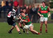 21 February 1999; Shane Sweeney of Ballina Stephenites is tackled by Brian Shanahan, left, and Padraig Conway of Doonbeg during the AIB All-Ireland Senior Club Football Championship Semi-Final match between Ballina Stephenites and Doonbeg at Duggan Park in Ballinasloe, Galway. Photo by Matt Browne/Sportsfile