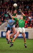 14 February 1999; Brian Stynes of Dublin in action against Adrian Charles and Adrian Cullen of Leitrim during the Church & General National Football League Division 1 match between Dublin and Leitrim at Parnell Park in Dublin. Photo by Damien Eagers/Sportsfile