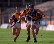 21 March 1999; Eddie Tucker of Tipperary in action against Declan Ruth and Rory McCarthy of Wexford during the Church and General National Hurling League Division 1B match between Tipperary and Wexford at Semple Stadium in Thurles, Tipperary. Photo by Ray McManus/Sportsfile