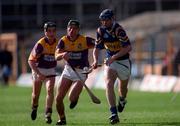 21 March 1999; Eddie Tucker of Tipperary in action against Declan Ruth and Rory McCarthy of Wexford during the Church and General National Hurling League Division 1B match between Tipperary and Wexford at Semple Stadium in Thurles, Tipperary. Photo by Ray McManus/Sportsfile
