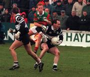 21 February 1999; Francis McInerney of Doonbeg is tackled by Brian McStay of Ballina Stephenites during the AIB All-Ireland Senior Club Football Championship Semi-Final match between Ballina Stephenites and Doonbeg at Duggan Park in Ballinasloe, Galway. Photo by Matt Browne/Sportsfile