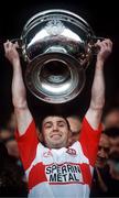 19 September 1993; Derry captain Henry Downey lifts the Sam Maguire Cup after defeating Cork in the All-Ireland Senior Football Championship match at Croke Park in Dublin. Photo by David Maher/Sportsfile