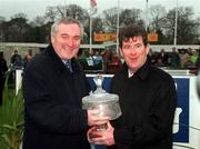 24 January 1999; Owner JP McManus, is presented with the AIG Championship Hurdle trophy by An Taoiseach Bertie Ahern after sending out Istabraq to win at Leopardstown Racecourse in Dublin. Photo by Ray McManus/Sportsfile