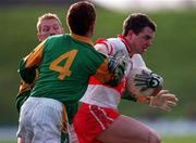 28 Feburary 1999; Joe Brolly of Derry in action against Graham Geraghty, left, and Donal Curtis of Meath during the Church and General National Football League Division 1 match between Meath and Derry at Páirc Tailteann in Navan, Meath. Photo by Ray McManus/Sportsfile