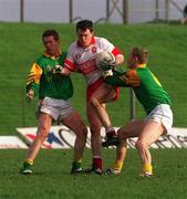 28 Feburary 1999; Joe Brolly of Derry in action against Graham Geraghty, right, and Donal Curtis of Meath during the Church and General National Football League Division 1 match between Meath and Derry at Páirc Tailteann in Navan, Meath. Photo by Ray McManus/Sportsfile