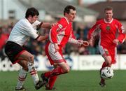 21 February 1999; John Caulfield of Cork City in action against Peter Hutton of Derry City during the Bord Gáis National League Premier Division match between Cork City and Derry City at Turners Cross in Cork. Photo by David Maher/Sportsfile