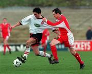 21 February 1999; Peter Hutton of Derry City in action against John Caulfield of Cork City during the Bord Gáis National League Premier Division match between Cork City and Derry City at Turners Cross in Cork. Photo by David Maher/Sportsfile