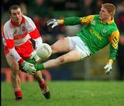 28 Feburary 1999; Raymond Magee of Meath in action against David O'Neill of Derry during the Church and General National Football League Division 1 match between Meath and Derry at Páirc Tailteann in Navan, Meath. Photo by Ray McManus/Sportsfile