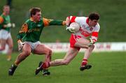 28 Feburary 1999; Ruairi Boylan of Derry in action against Nigel Crawford of Meath during the Church and General National Football League Division 1 match between Meath and Derry at Páirc Tailteann in Navan, Meath. Photo by Ray McManus/Sportsfile