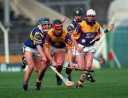 21 March 1999; Ryan Quigley of Wexford in action against Eddie Enright of Tipperary during the Church and General National Hurling League Division 1B match between Tipperary and Wexford at Semple Stadium in Thurles, Tipperary. Photo by Ray McManus/Sportsfile