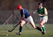 13 March 1999; Ronald Ross of Scotland is tackled by Brian Whelahan of Ireland during the Shinty International match between Scotland and Ireland at Bught Park in Inverness, Scotland. Photo by Ray McManus/Sportsfile