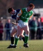 13 March 1999; Victor Smith of Scotland is tackled by Niall Rigney of Ireland during the Shinty International match between Scotland and Ireland at Bught Park in Inverness, Scotland. Photo by Ray McManus/Sportsfile