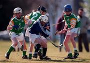 13 March 1999; Lorne MacKay of Scotland in action against Eamonn Pendergast, left, Mark Early, 2, and Jonathan Reidy of Ireland during the Under-12 International Challenge Match, between Scotland and Ireland, which finished 2-2, at half-time of the Shinty International match between Scotland and Ireland at Bught Park in Inverness, Scotland. Photo by Ray McManus/Sportsfile