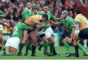 10 October 1999; Joe Roff, Australia, is tackled by David Humphries, and Keith Wood, no.2, Ireland. 1999 Rugby World Cup, Ireland v Australia, Lansdowne Road, Dublin. Picture credit: Matt Browne / SPORTSFILE