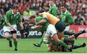 10 October 1999; Jonathan Bell, Ireland, is tackled by Tim Horan (grounded) and Tiann Strauss, Australia. 1999 Rugby World Cup, Ireland v Australia, Lansdowne Road, Dublin. Picture credit: Brendan Moran / SPORTSFILE
