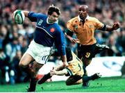 6 November 1999; Christophe Dominici, France, in action against Stephen Larkham, Australia. 1999 Rugby World Cup, Australia v France, Millennium Stadium, Cardiff, Wales. Picture credit: Matt Browne / SPORTSFILE