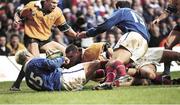 6 November 1999; Ben Tune, Australia, supported by team-mate Jason Little, no.16, goes over the line for a try as France's Xavier Garbajosa, no.15, and Richard Dourthe, no.13, attempt to stop him. 1999 Rugby World Cup, Australia v France, Millennium Stadium, Cardiff, Wales. Picture credit: Matt Browne / SPORTSFILE