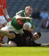 24 April 2005; Andy Moran, Mayo, falls over the Armagh goalkeeper Paul Hearty. Allianz National Football League Semi-Final, Armagh v Mayo, Croke Park, Dublin. Picture credit; Ray McManus / SPORTSFILE