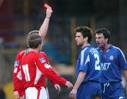 25 April 2005; Referee David Best, hidden, shows the red card to Cullen Feeney, no. 2 , Portadown, during the second half. Setanta Cup, Group 2, Portadown v Shelbourne, Shamrock Park, Portadown, Co. Armagh. Picture credit; David Maher / SPORTSFILE